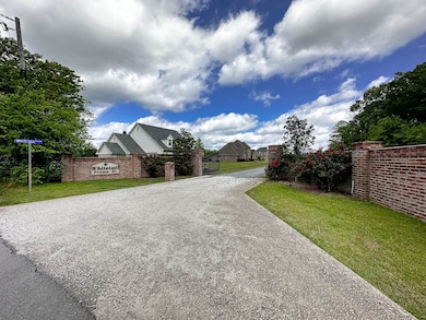 Small private neighborhood, 10 homes total with gated entrance and elegant brick walls.