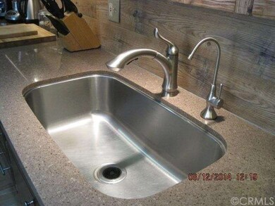 Quartz kitchen counter top with deep stainless ste