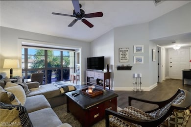 Living room with lofted ceiling, wood finished flo