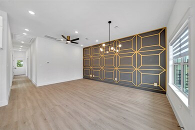 Living space features sleek wood flooring, a strik