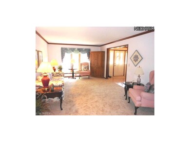 Spacious Formal Living room boasts new carpeting