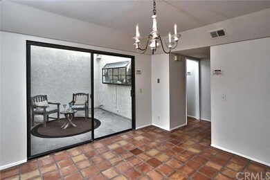 Dining room with sliding glass door to atrium