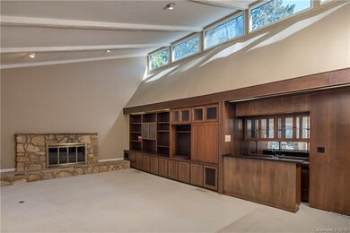 Family room with fireplace, wet bar and build in c