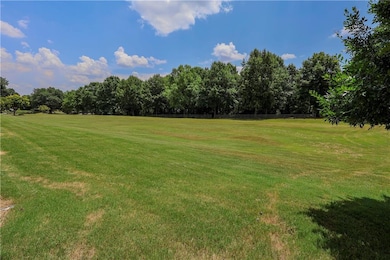 View of grassy yard with a view of countryside
