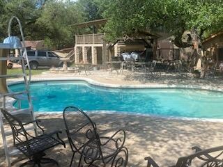 Swimming pool with a patio area