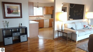 Foyer to living room and kitchen
