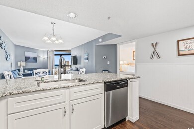Kitchen featuring sink, light stone counters, deco