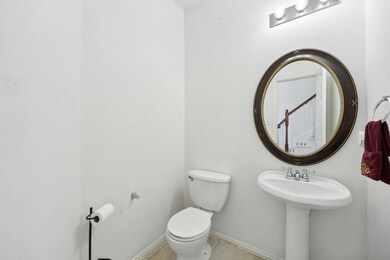 Bathroom featuring toilet and tile patterned floor