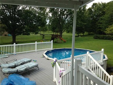 Exterior Back. Back deck and pool from sunroom