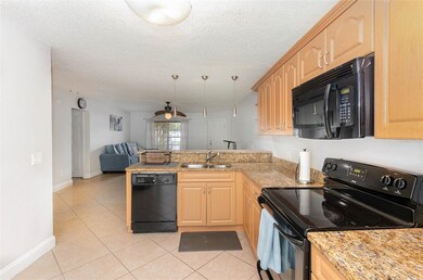 Kitchen overlooks the living area 