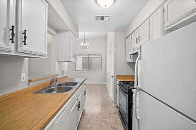 Kitchen with a view of the living room