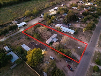 Aerial overview of property's location featuring property parcel outlined
