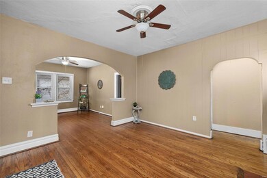 This residence exudes character, featuring lofty ceilings and elegant arched passageways