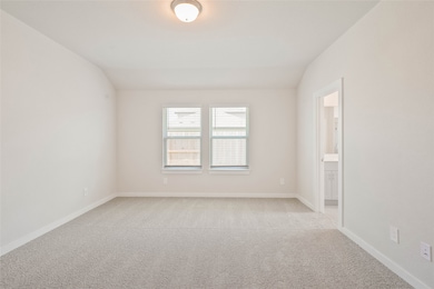 This photo shows a spacious, bright bedroom with n