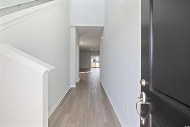 Corridor with light wood-type flooring
