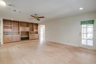 Unfurnished living room with ceiling fan and light