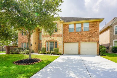 Trending now is the blend of brick and stone exterior. 4667 square feet on a corner lot.