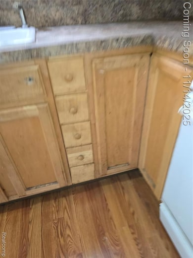 Kitchen view of dark wood-style flooring