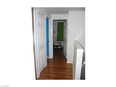 SECOND FLOOR HALL WAY WITH HARDWOOD FLOORING