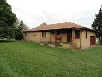 Exterior Back. Covered porch for relaxing around a