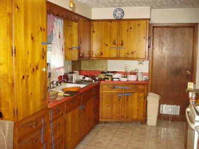 eat in kitchen, knotty pine cupboards