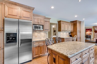 Kitchen remodel includes custom Birch cabinets, st