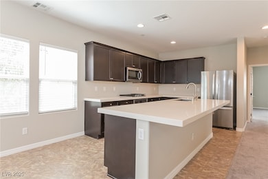 Kitchen featuring appliances with stainless steel