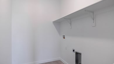 Laundry room featuring washer hookup and hookup for an electric dryer