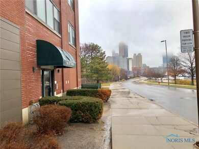 Entrance to building and the city scape beyond.  T