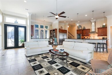 View of Den, Kitchen and Wet Bar.  High ceilings a