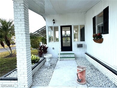 View of exterior entry featuring covered porch