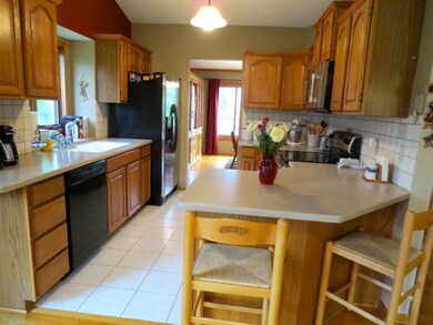 Another view or the kitchen featuring a breakfast 