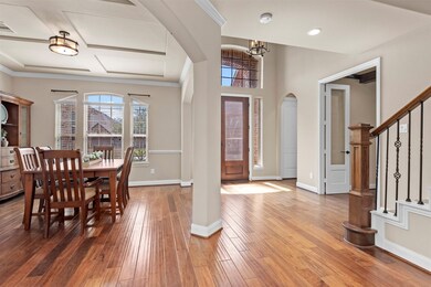 Thoughtfully chosen neutral tones and elegant finishes create a timeless backdrop that complements a variety of interior design styles. Gleaming hardwood floors enhance the space in the entry and throughout the living areas downstairs.