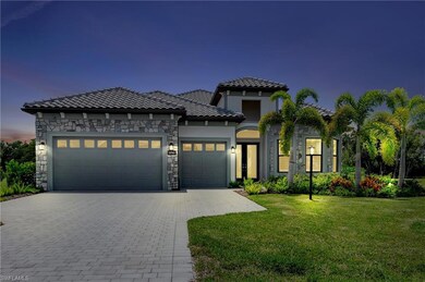 Night view of of luxurious stone accent home with 