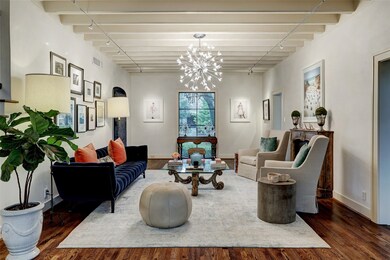 Looking towards the front lawn and offering wonderful finishes and a cozy fireplace. Sure to inspire delightful conversation.