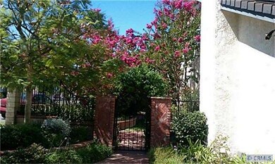 brick path leads to side entry to yard