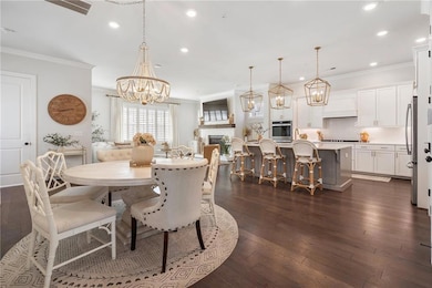 Enter from screen porch or garage into open dining