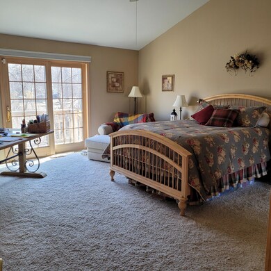 Main floor master bedroom with deck