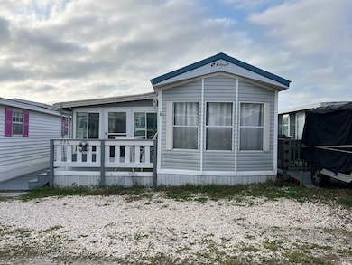 Back of property with a wooden deck