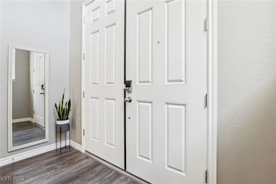 Entrance foyer featuring dark hardwood / wood-styl