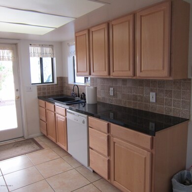 Kitchen with granite tile counters