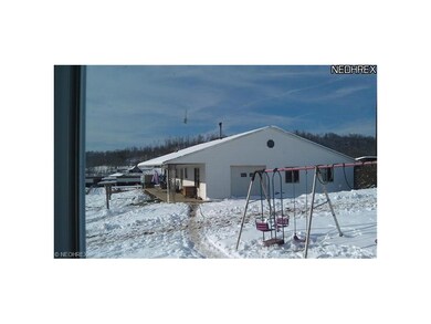 slab type ranch home with garage and work shop