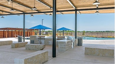 View of patio featuring a fenced in pool, grilling