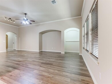 Living room featuring ceiling fan, rail lighting, 
