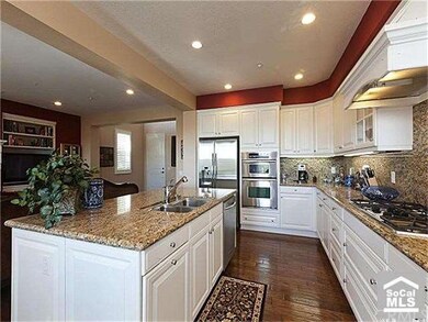 Open and Bright Kitchen with Stainless Steel Appli