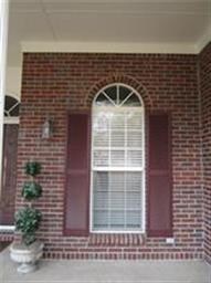 Arched windows enhance the beauty of the covered f