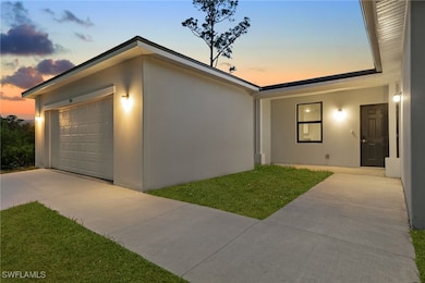 View of front of house with stucco siding