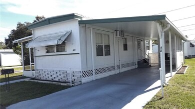 The large carport provides protected parking for u