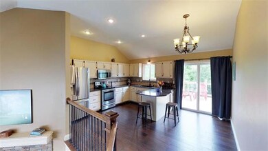 HARDWOODS EXTEND INTO KITCHEN & DINING AREA.