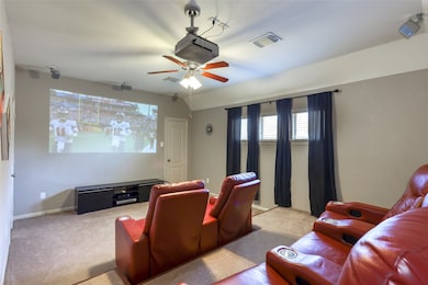 2nd Floor media room with plenty of space for the entire family to watch movies without spending a fortune going out to the cinema. There is an attached 1/2 bath in the media room as well.